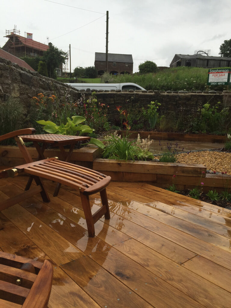 Newly laid wooden decking with seating