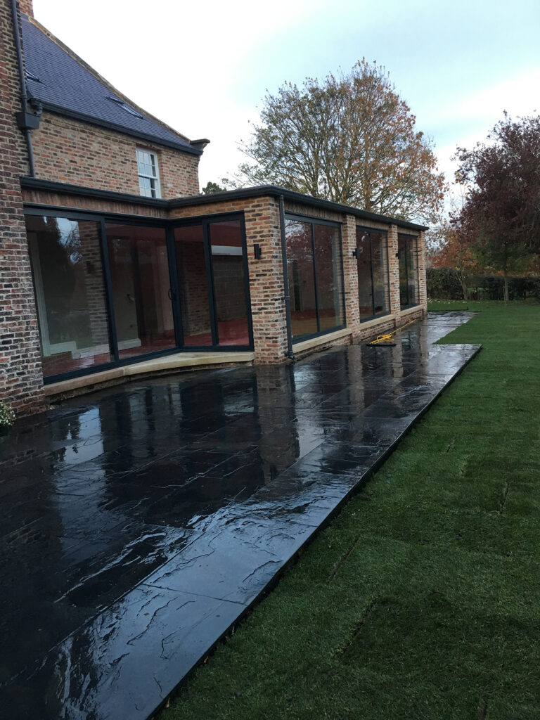 Slate patio and freshly laid lawn