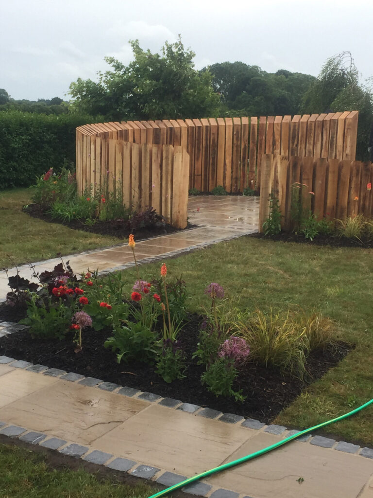 Sweeping circular wooden garden feature